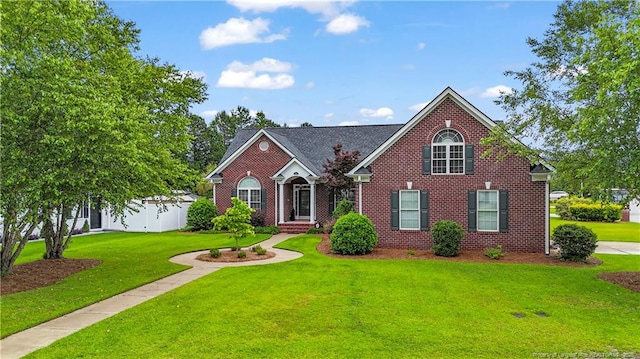 6500 Oakley Dr, Fayetteville, NC 28311 - traditional-style house featuring a front lawn and brick siding