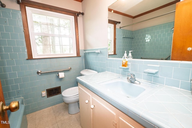 205 N Augusta Ave, Benson, NC 27504 - bathroom featuring tile walls, toilet, tile patterned flooring, vanity, and ornamental molding