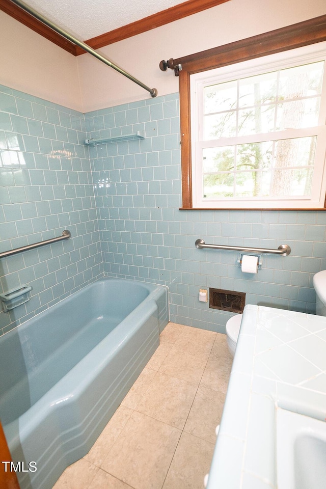 205 N Augusta Ave, Benson, NC 27504 - bathroom featuring toilet, tile patterned floors, tile walls, and  shower combination