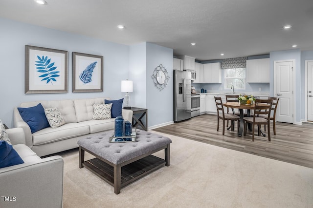 220 Gianna Dr, Lillington, NC 27546 - living area with recessed lighting, baseboards, and light wood-style floors