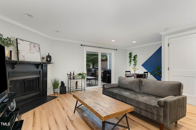 110 Taylors Pond Dr, Cary, NC 27511 - living area with light wood-type flooring, a fireplace with flush hearth, ornamental molding, and recessed lighting