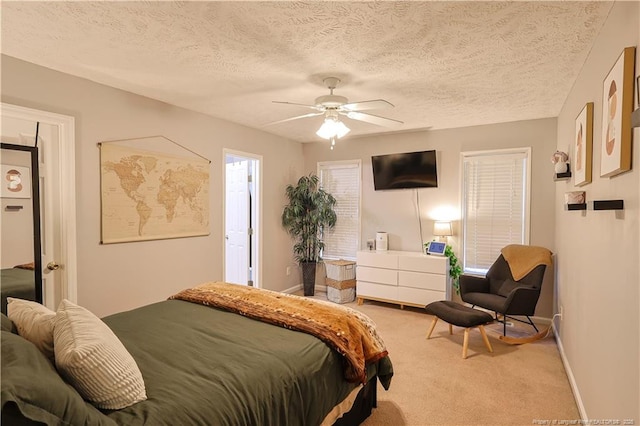 119 Proclamation Dr, Raeford, NC 28376 - bedroom with carpet floors, baseboards, ceiling fan, and a textured ceiling