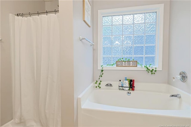 119 Proclamation Dr, Raeford, NC 28376 - full bathroom with healthy amount of natural light, a bath, and a shower with shower curtain