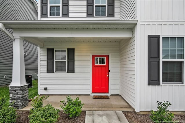 1664 Seattle Slew Ln, Hope Mills, NC 28348 - doorway to property with board and batten siding and covered porch