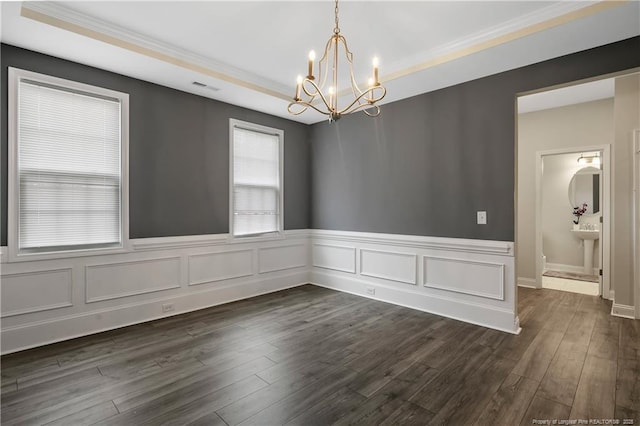 1664 Seattle Slew Ln, Hope Mills, NC 28348 - empty room with a chandelier, wainscoting, dark wood finished floors, and ornamental molding