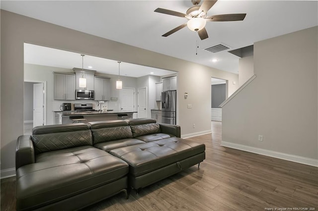 1664 Seattle Slew Ln, Hope Mills, NC 28348 - living room featuring baseboards, a ceiling fan, dark wood finished floors, and recessed lighting