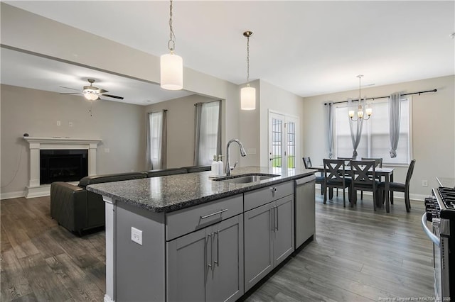 1664 Seattle Slew Ln, Hope Mills, NC 28348 - kitchen with a sink, stainless steel appliances, gray cabinets, dark wood-style floors, and ceiling fan