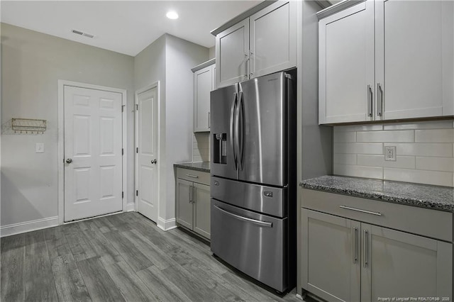 1664 Seattle Slew Ln, Hope Mills, NC 28348 - kitchen featuring stainless steel fridge, backsplash, dark wood-type flooring, baseboards, and recessed lighting