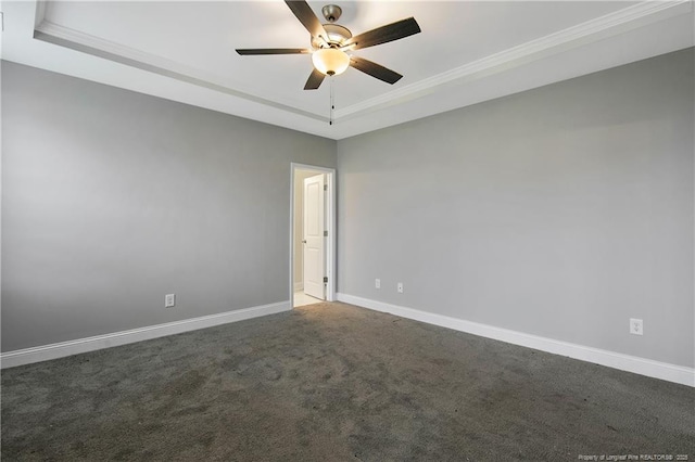 1664 Seattle Slew Ln, Hope Mills, NC 28348 - carpeted spare room featuring a raised ceiling, ceiling fan, baseboards, and crown molding
