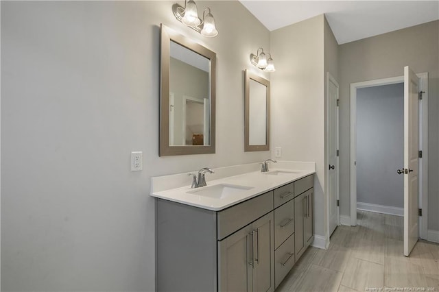 1664 Seattle Slew Ln, Hope Mills, NC 28348 - bathroom with double vanity and baseboards