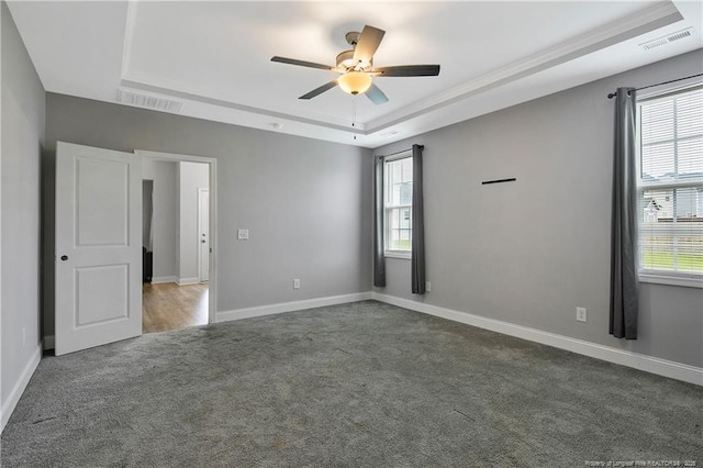 1664 Seattle Slew Ln, Hope Mills, NC 28348 - unfurnished room with carpet floors, a tray ceiling, a ceiling fan, and baseboards
