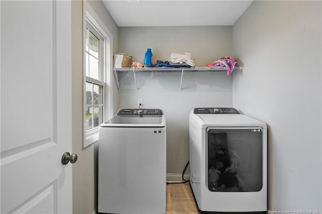 1664 Seattle Slew Ln, Hope Mills, NC 28348 - laundry room with washer and clothes dryer and light wood-style floors