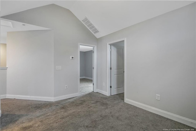 1664 Seattle Slew Ln, Hope Mills, NC 28348 - spare room with vaulted ceiling, carpet, and baseboards