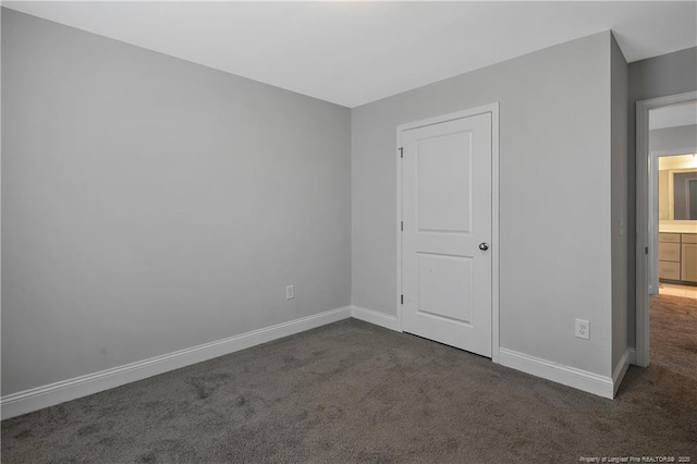 1664 Seattle Slew Ln, Hope Mills, NC 28348 - unfurnished bedroom featuring carpet and baseboards