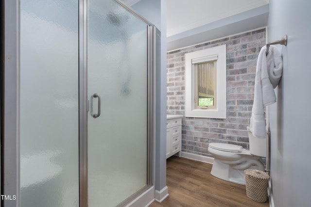 1822 Routh Rd, Burlington, NC 27217 - bathroom with brick wall, a stall shower, toilet, and wood finished floors
