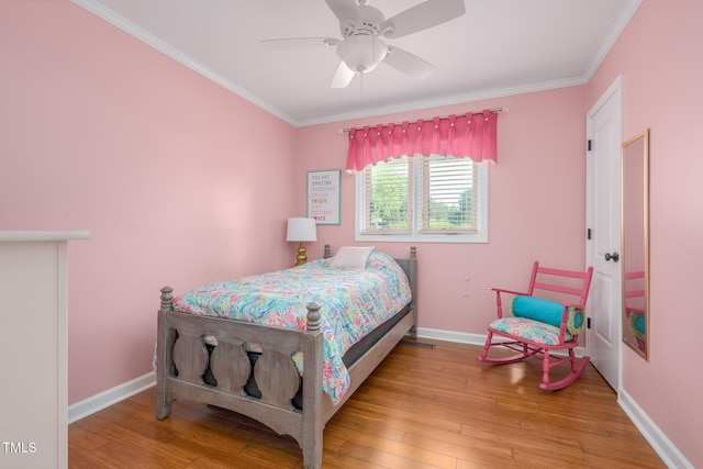 1822 Routh Rd, Burlington, NC 27217 - bedroom with crown molding, wood finished floors, baseboards, and ceiling fan