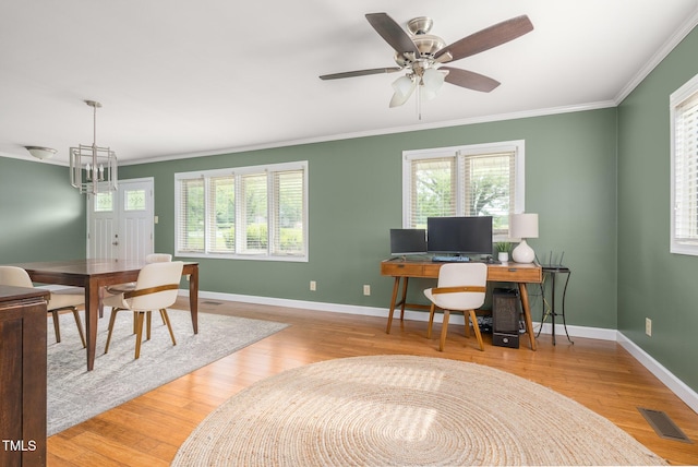 1822 Routh Rd, Burlington, NC 27217 - home office with crown molding, healthy amount of natural light, baseboards, and wood finished floors