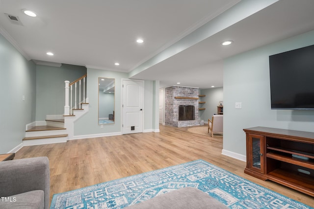 1822 Routh Rd, Burlington, NC 27217 - living room with ornamental molding, stairway, wood finished floors, a brick fireplace, and recessed lighting