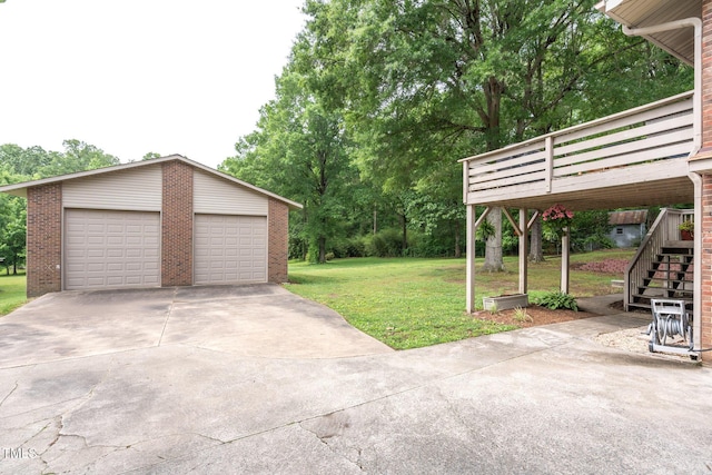 1822 Routh Rd, Burlington, NC 27217 - view of grassy yard featuring stairway, a detached garage, an outdoor structure, and a wooden deck