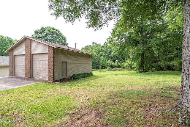 1822 Routh Rd, Burlington, NC 27217 - view of grassy yard with a detached garage and an outdoor structure