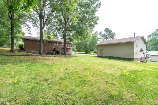 1822 Routh Rd, Burlington, NC 27217 - view of grassy yard with stairway and a deck