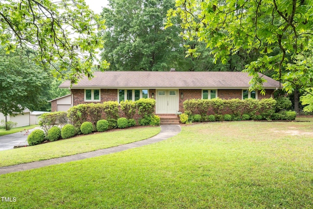 1822 Routh Rd, Burlington, NC 27217 - ranch-style home with brick siding, a front yard, and a shingled roof