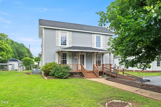 2527 Ossipee Front St, Elon, NC 27244 - view of front of home with covered porch, a front lawn, and central AC unit