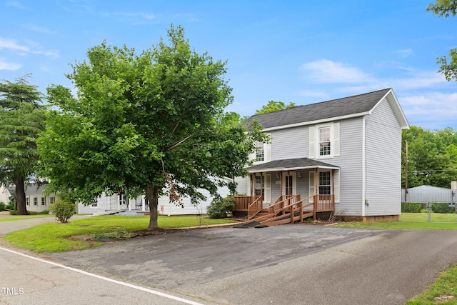 2527 Ossipee Front St, Elon, NC 27244 - view of front of property with covered porch, roof with shingles, and a front lawn