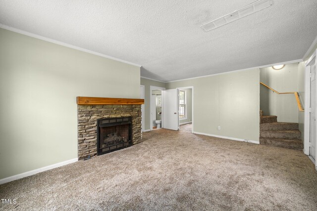 2527 Ossipee Front St, Elon, NC 27244 - unfurnished living room featuring stairs, crown molding, carpet, a stone fireplace, and a textured ceiling