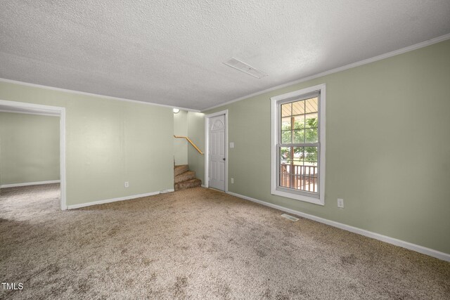 2527 Ossipee Front St, Elon, NC 27244 - empty room featuring ornamental molding, stairway, carpet flooring, a textured ceiling, and baseboards