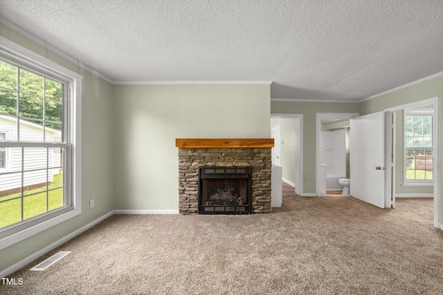 2527 Ossipee Front St, Elon, NC 27244 - unfurnished living room with a textured ceiling, crown molding, a fireplace, carpet, and baseboards