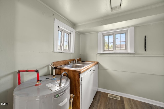 2527 Ossipee Front St, Elon, NC 27244 - kitchen with water heater, dark wood finished floors, a sink, and baseboards