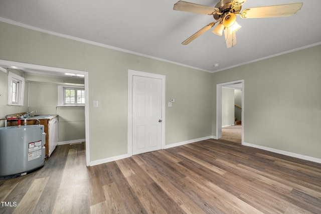 2527 Ossipee Front St, Elon, NC 27244 - empty room with water heater, ornamental molding, wood finished floors, ceiling fan, and baseboards