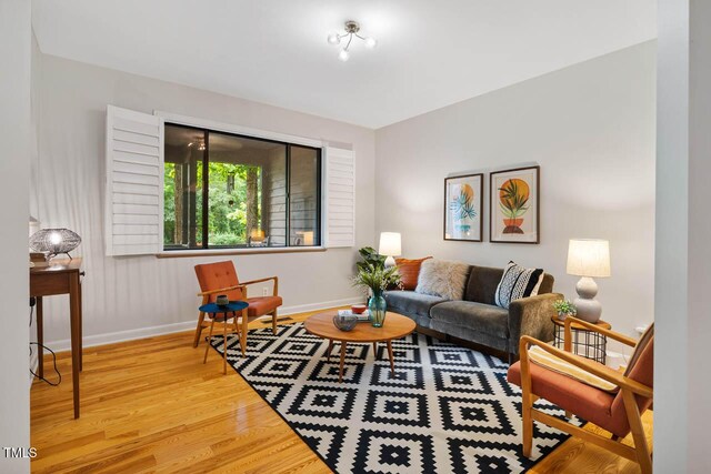 8821 Oconee Ct, Chapel Hill, NC 27516 - living area featuring wood finished floors and baseboards