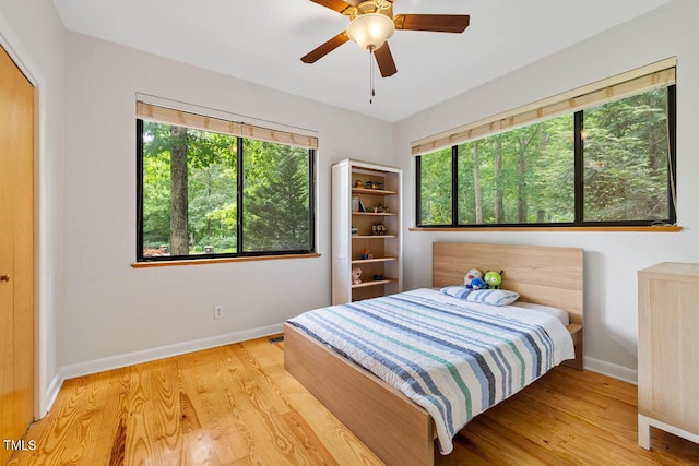 8821 Oconee Ct, Chapel Hill, NC 27516 - bedroom featuring baseboards, wood finished floors, and ceiling fan