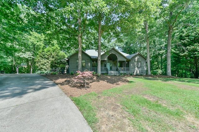 8821 Oconee Ct, Chapel Hill, NC 27516 - ranch-style home featuring covered porch, concrete driveway, a front yard, and crawl space
