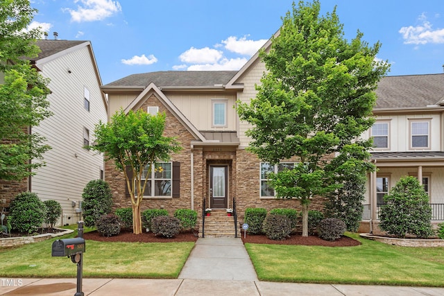 5003 Blue Jack Oak Dr, Cary, NC 27519 - view of front facade featuring a front lawn, board and batten siding, a standing seam roof, and roof with shingles