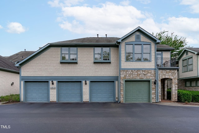 201 Presque Isle Ln, Chapel Hill, NC 27514 - view of front facade featuring an attached garage, asphalt driveway, stone siding, and a shingled roof