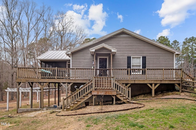 501 Enon Rd, Oxford, NC 27565 - rear view of house with stairs, a wooden deck, a yard, and a sunroom