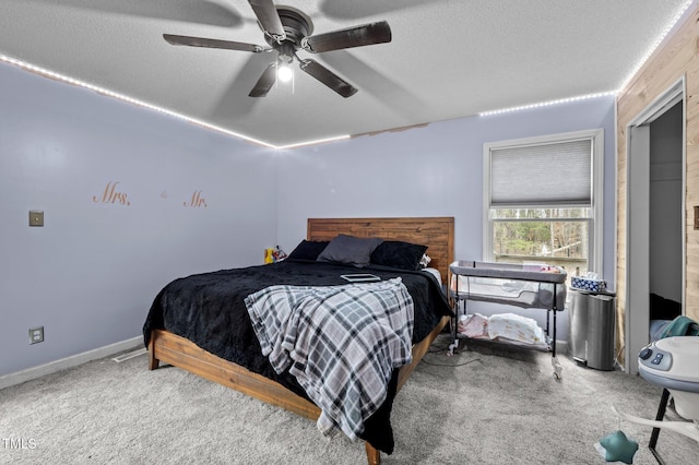 501 Enon Rd, Oxford, NC 27565 - bedroom with carpet floors, a textured ceiling, a ceiling fan, and baseboards