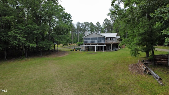 501 Enon Rd, Oxford, NC 27565 - view of grassy yard with a wooden deck and view of wooded area