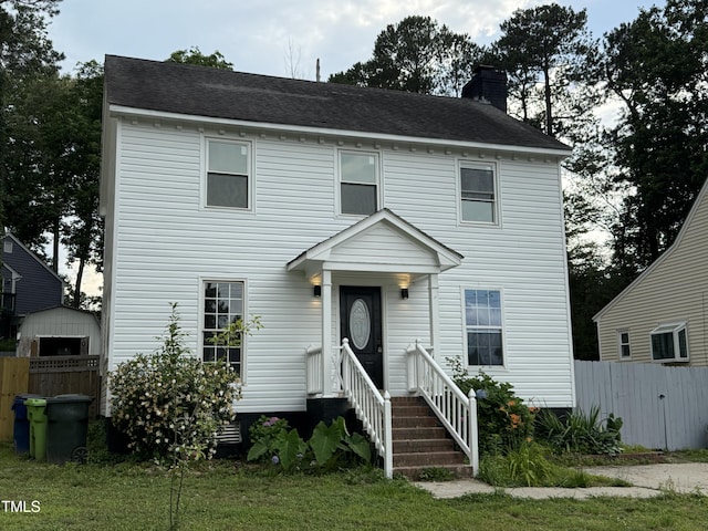 3825 Old Coach Rd, Raleigh, NC 27616 - view of front facade featuring a chimney, entry steps, and a shingled roof