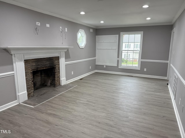 3825 Old Coach Rd, Raleigh, NC 27616 - unfurnished living room with crown molding, a fireplace, wood finished floors, baseboards, and recessed lighting