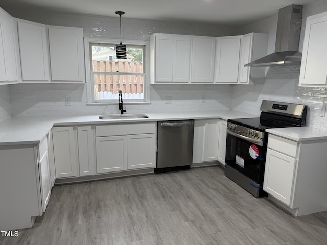 3825 Old Coach Rd, Raleigh, NC 27616 - kitchen with stainless steel appliances, wall chimney range hood, a sink, and decorative backsplash