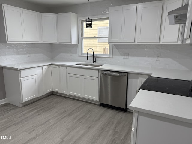 3825 Old Coach Rd, Raleigh, NC 27616 - kitchen featuring stainless steel dishwasher, a sink, light countertops, decorative backsplash, and white cabinetry
