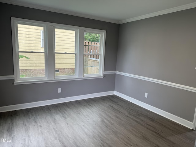 3825 Old Coach Rd, Raleigh, NC 27616 - spare room with dark wood-type flooring, baseboards, and crown molding