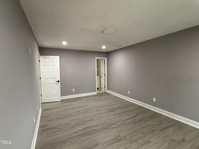 3825 Old Coach Rd, Raleigh, NC 27616 - empty room with baseboards, wood finished floors, and recessed lighting
