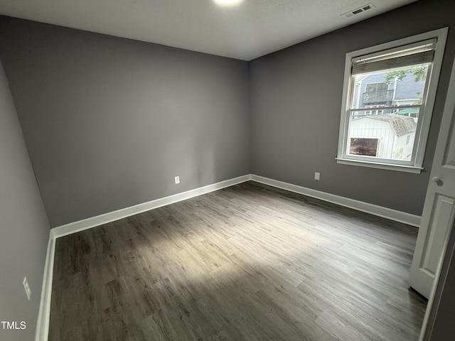 3825 Old Coach Rd, Raleigh, NC 27616 - unfurnished room with dark wood finished floors and baseboards