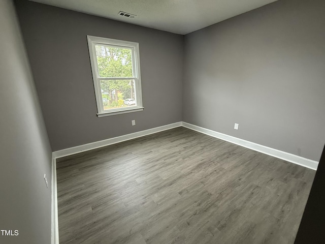 3825 Old Coach Rd, Raleigh, NC 27616 - unfurnished room with dark wood-style flooring and baseboards