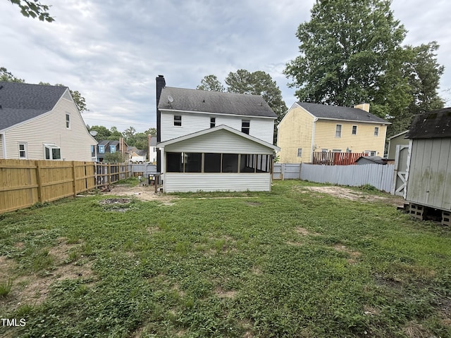 3825 Old Coach Rd, Raleigh, NC 27616 - rear view of house featuring a sunroom and a chimney